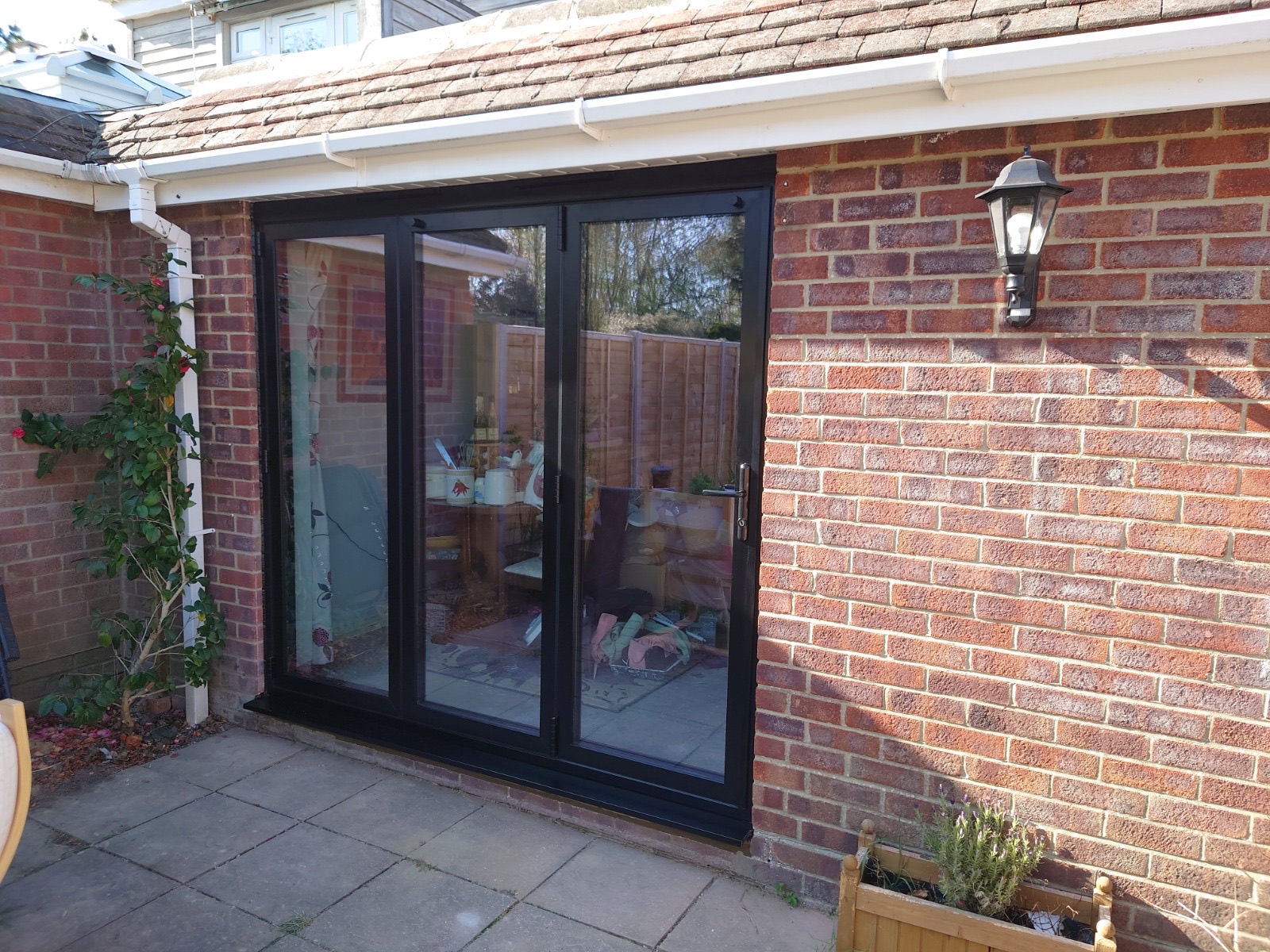 Aluminium bi-fold doors opening onto a garden