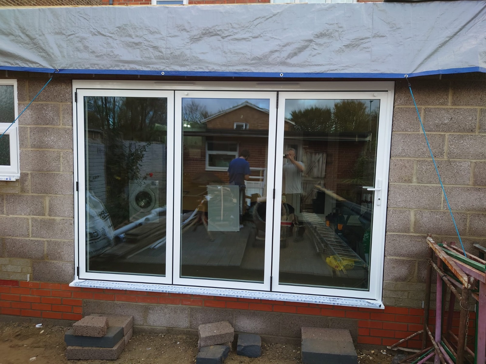 Aluminium bi-fold doors mid-installation
