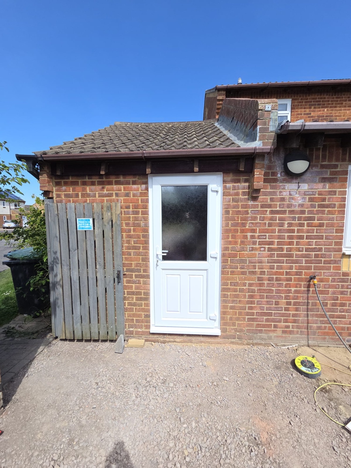 New back door fitted in a rebuilt brick opening