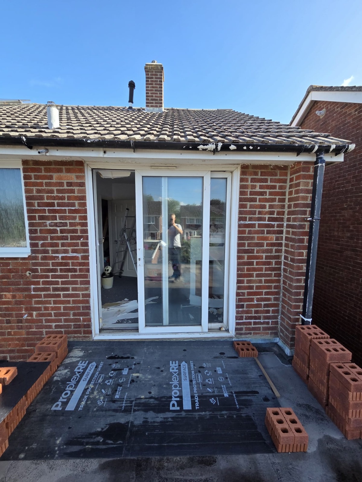 New patio doors fitted in a widened brick opening