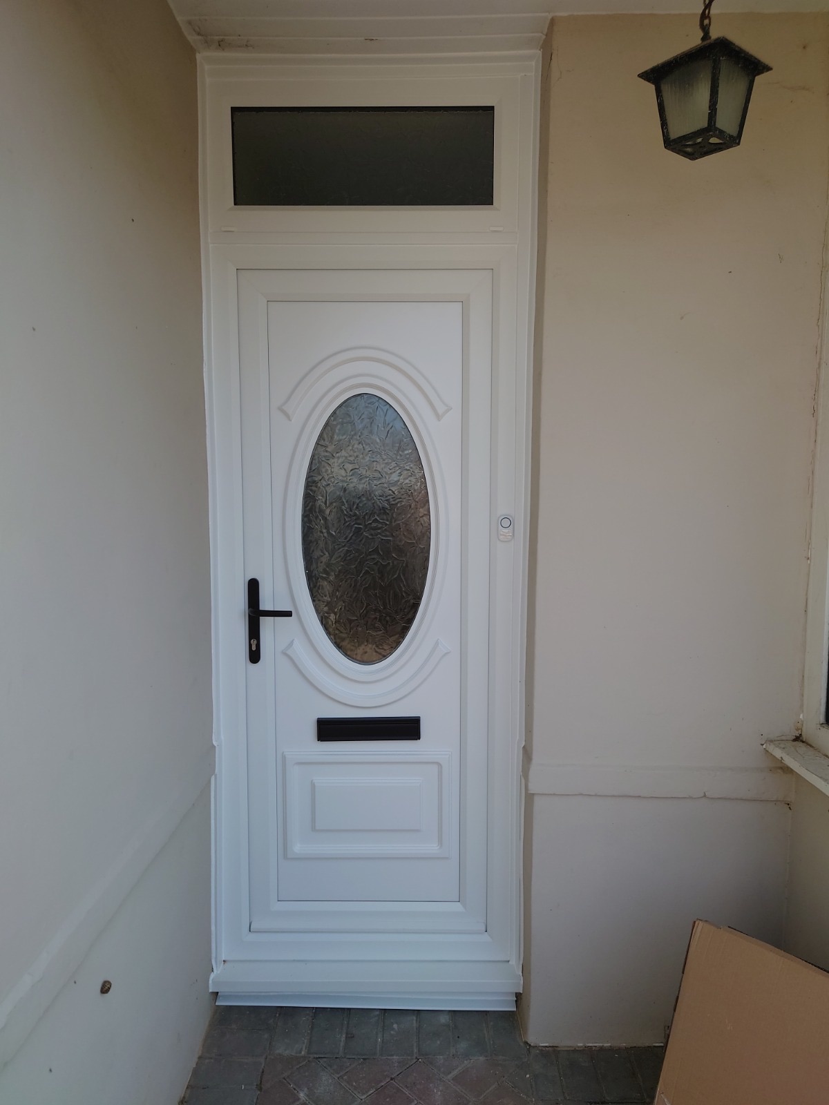 White uPVC door with a glazed toplight, fitted by HDS