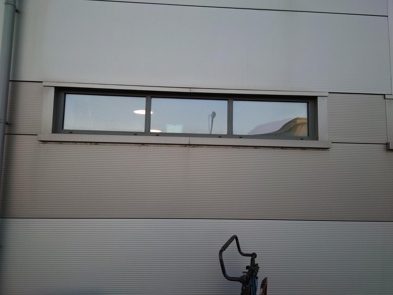 A cracked window pane before repair